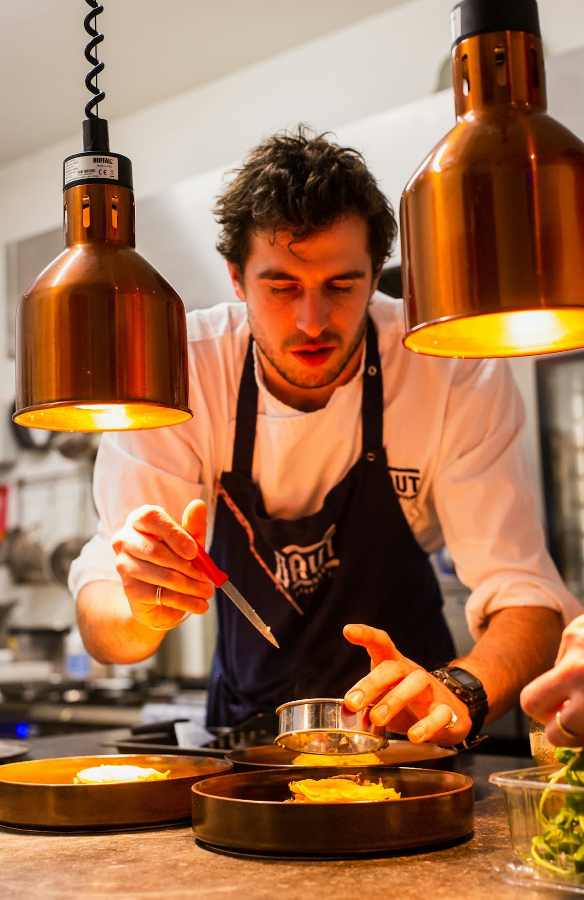 Chef cooking in a professional Indian restaurant kitchen